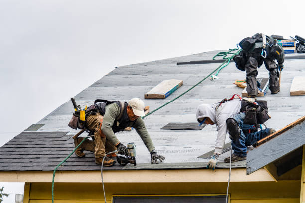 Professional Storm Damage Roof Repair technician working in East Sparta, OH